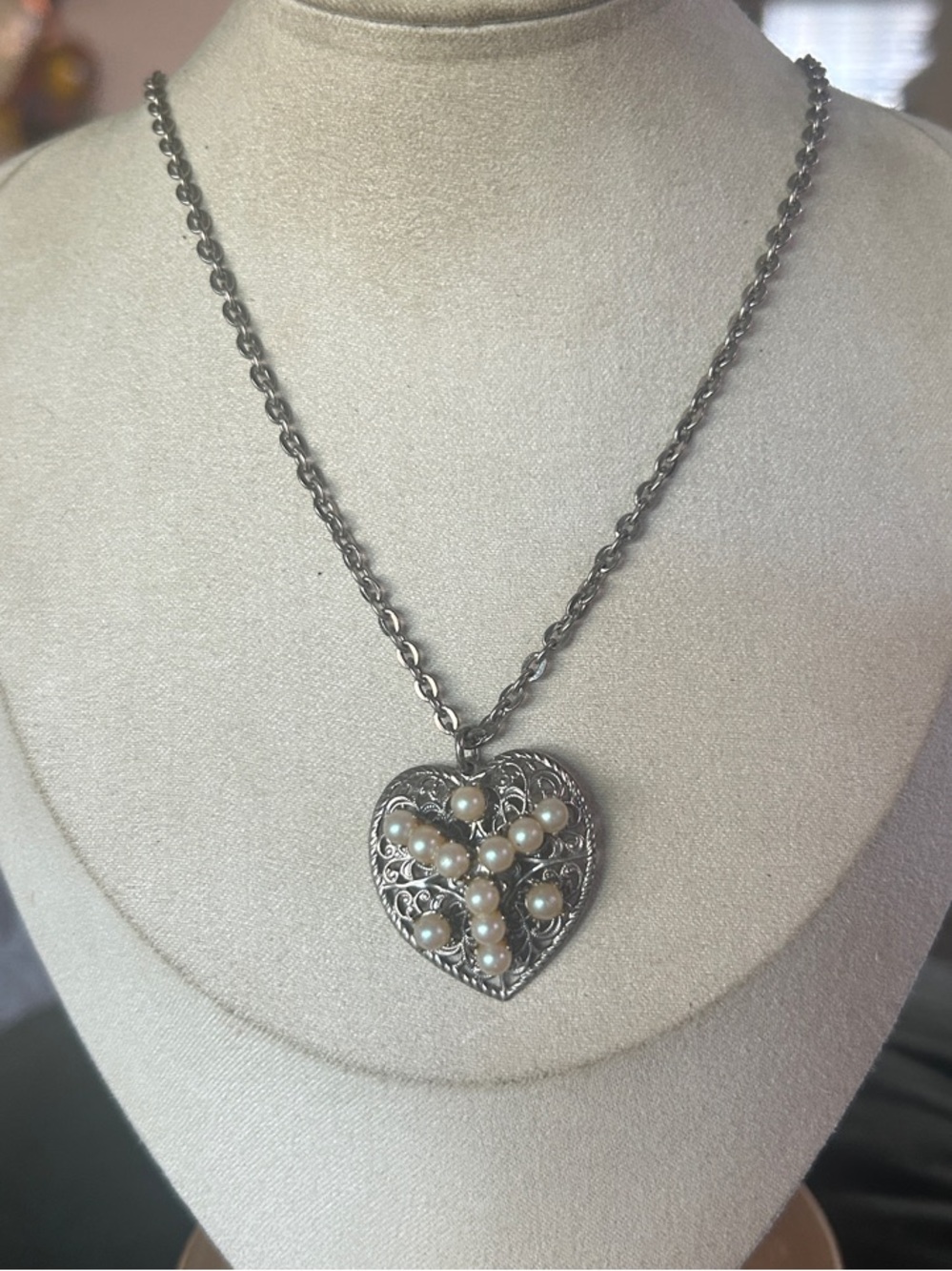 Intricate Victorian-style filigree heart pendant